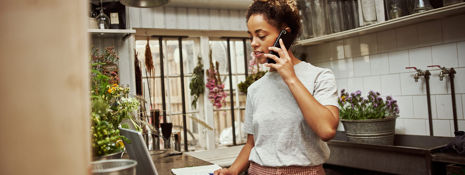 Business owner using phone in home office