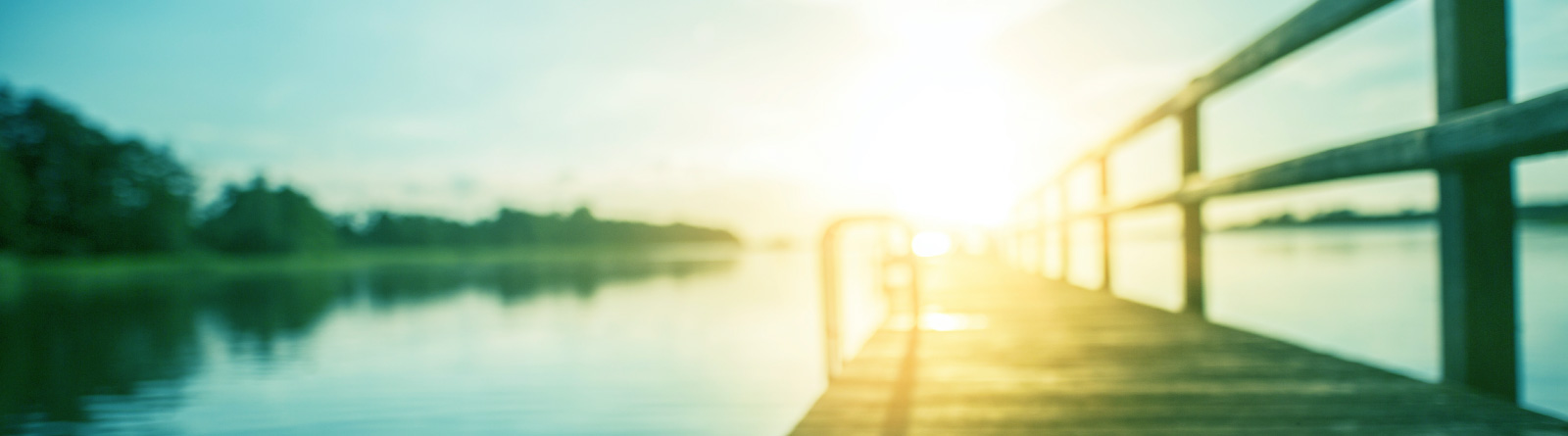 sitting at the dock of the bay overlooking a sunset